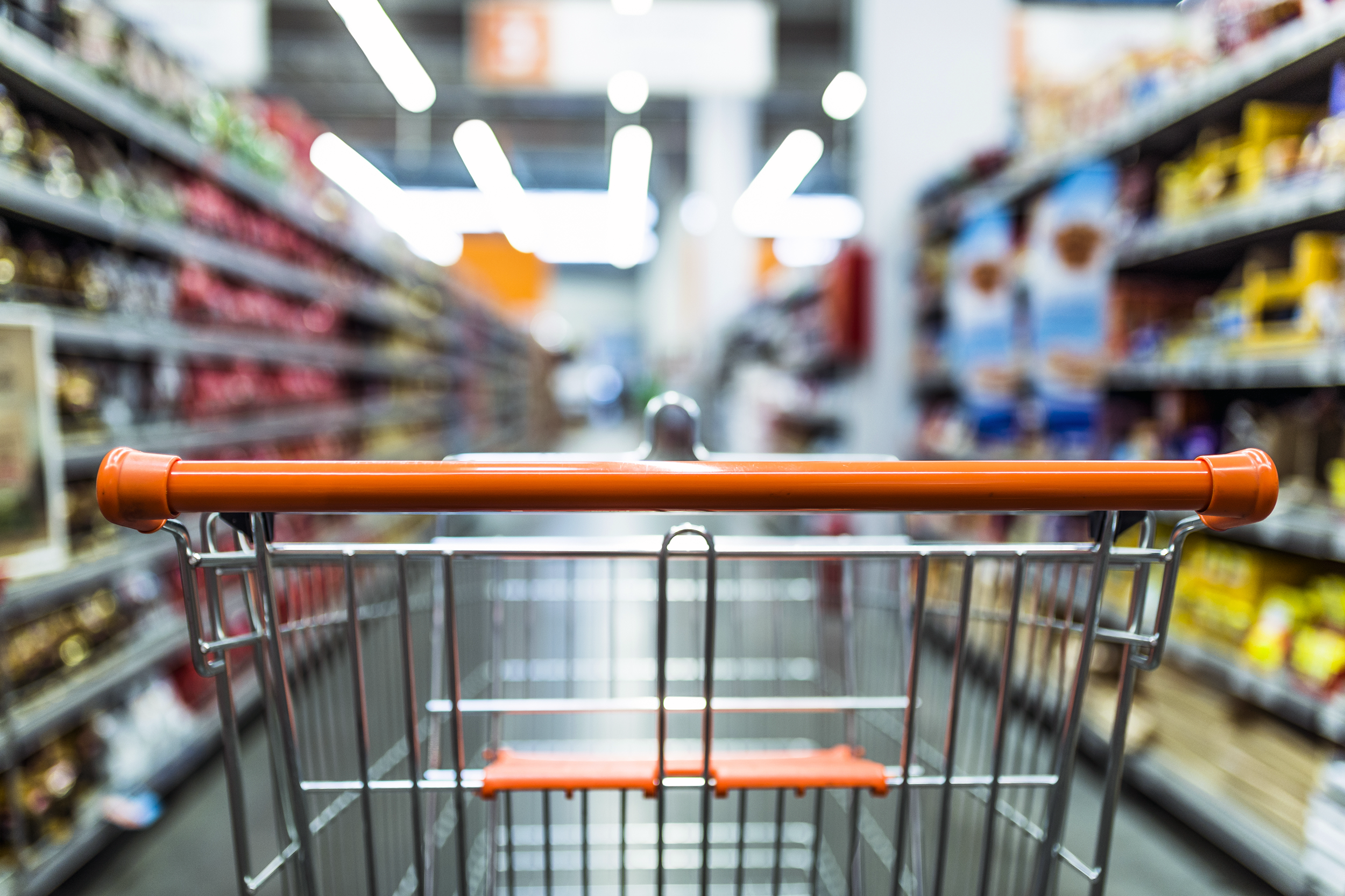 Shopping cart in a grocery store aisle