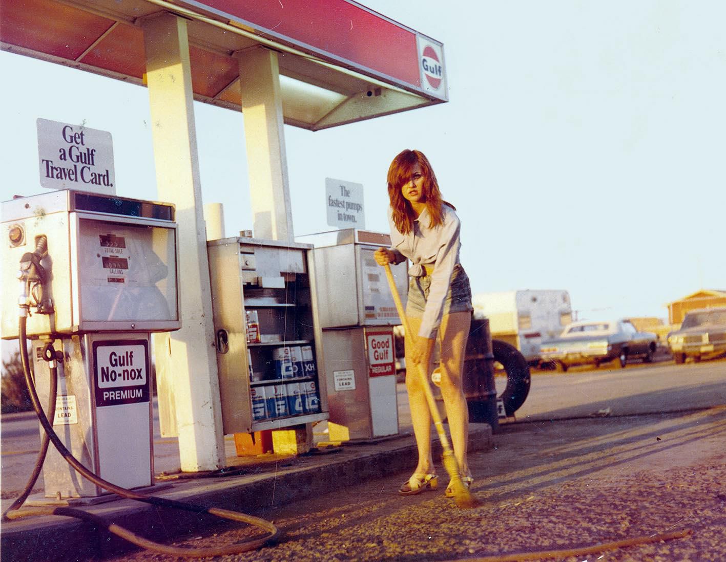 A Gulf gas station 1981 woman at pump