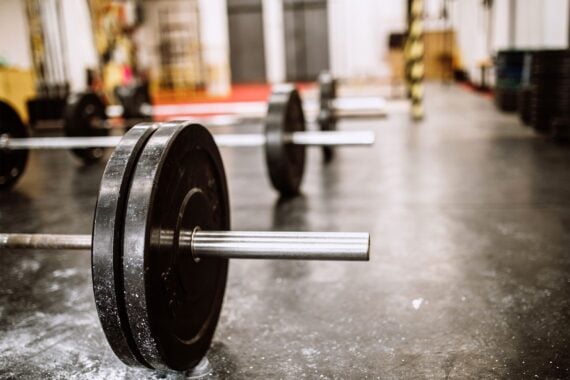 Closeup of barbell in an empty gym