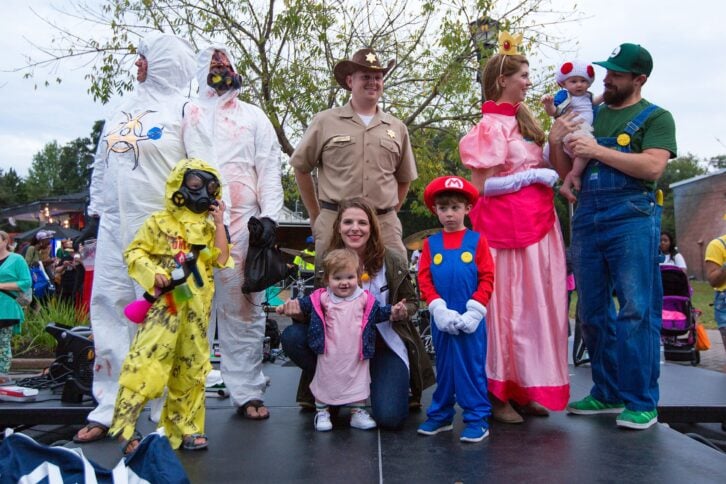 Family dressed in Halloween costumes