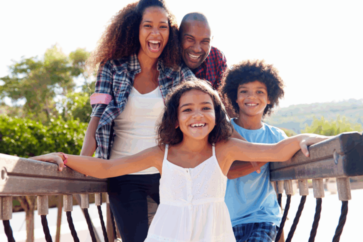 Happy family playing outside