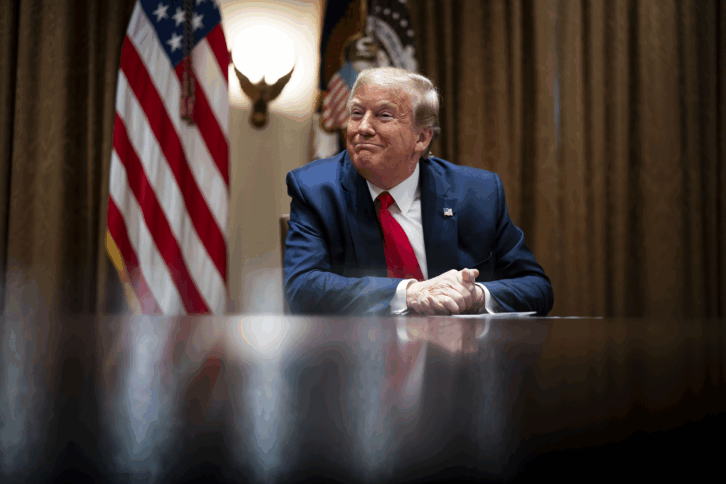 President Donald Trump listens during a meeting with healthcare executives in the Cabinet Room of the White House