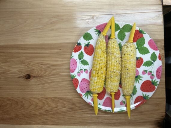three cobs of corn on a plate