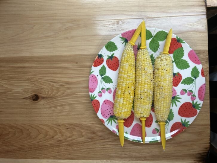 three cobs of corn on a plate