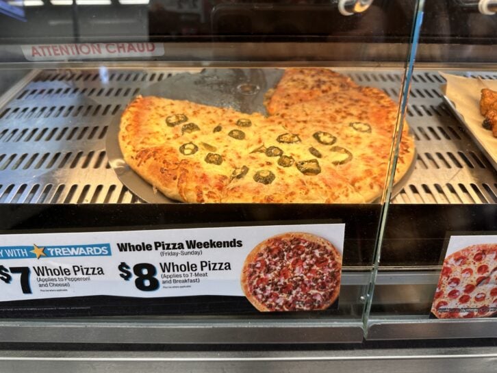 a jalapeno pizza on a warming tray at 7-11