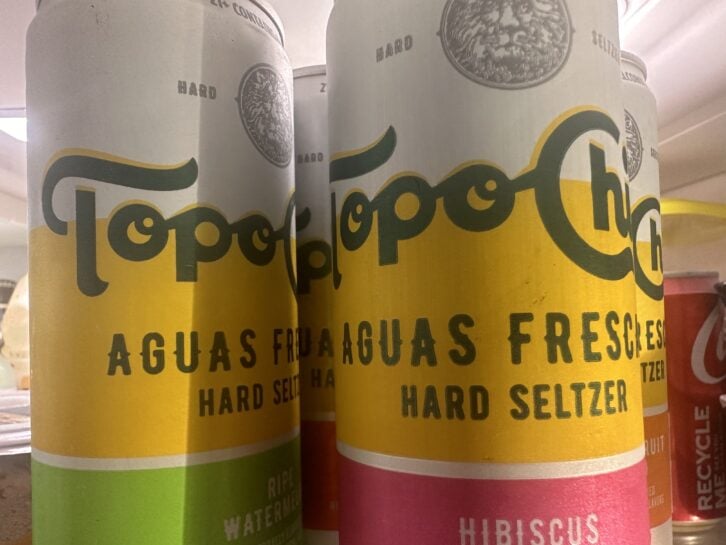Topo Chico hard seltzers in a refrigerator