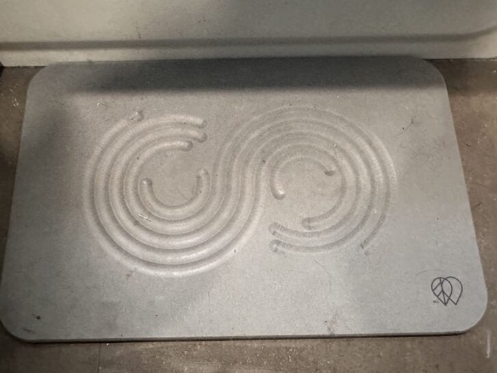 stone bathmat on floor