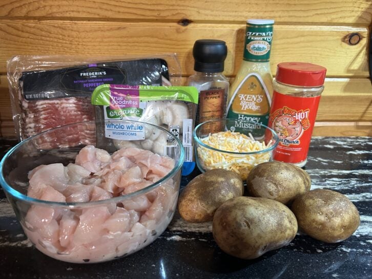 chunks of chicken, seasoning, potatoes, peppered bacon, shredded cheese, and honey mustard