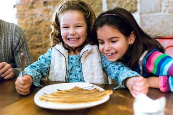 Happy kids ready to eat breakfast