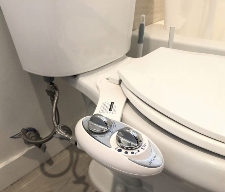 Side view of toilet and Luxe Bidet W85 bidet attachment