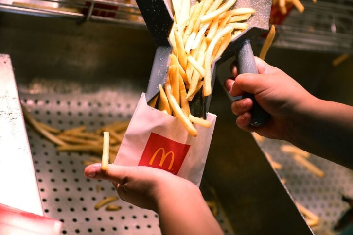 McDonald's employee preparing French fries
