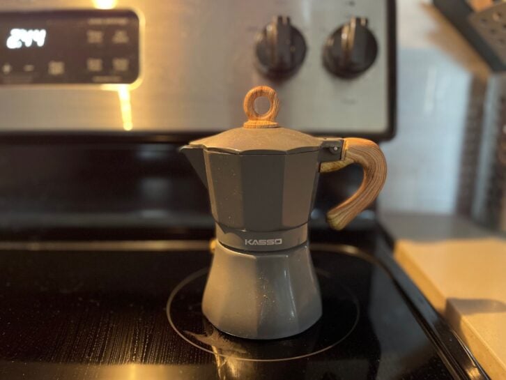 Moka pot pictured on a stovetop