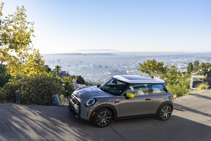 MINI Cooper SE heads up a city hill