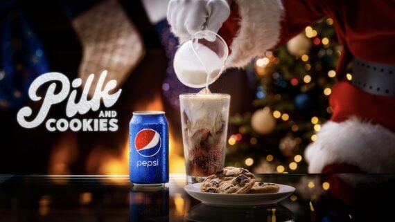 Pepsi with milk in it and a plate of cookies