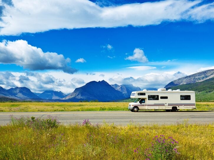 Glacier National Park, Montana, USA. Visitors in camper RV traveling to Glacier National Park touring the park along the breathtaking 'Going To The Sun Road'. The scenic road wind through the national park along steep mountain cliffs and valleys.