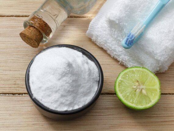 baking soda and lemon on wooden table