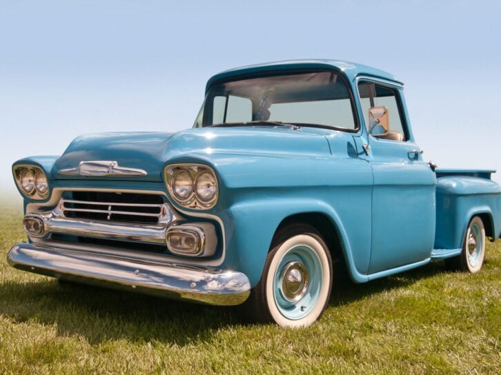 A Classic American Pickup Truck Sitting in a Field.