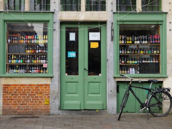 Beer Store's Window in Ghent, Belgium. Beer in Belgium varies from pale lager to amber ales, lambic beers, Flemish red ales, sour brown ales, strong ales and stouts. There are approximately hundreds of active breweries in Belgium.