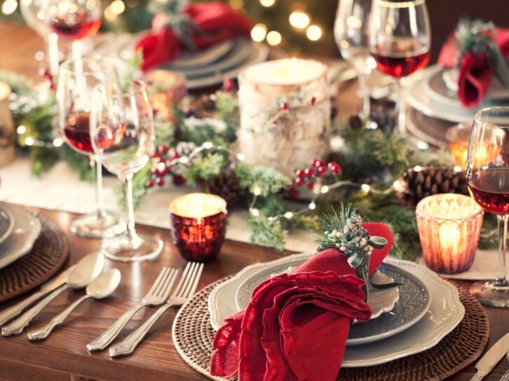 Christmas holiday dining table elegant place setting. Very shallow depth