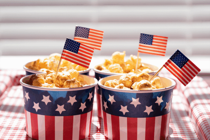 Patriotic cups of popcorn with American flags