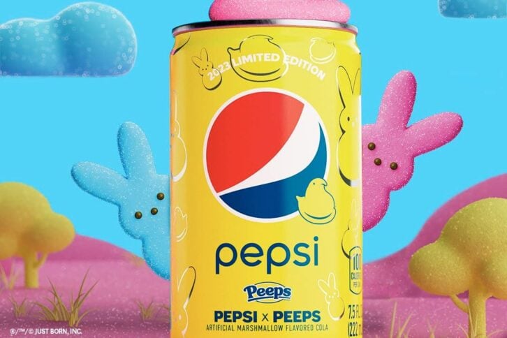 A photo showing a bottle of Pepsi X Peeps laying in a bed of Peeps candies