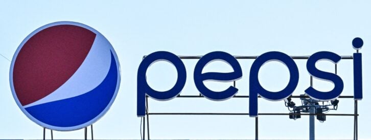 A photograph shows the logo of US multinational food, snack, and beverage corporation PepsiCo.
