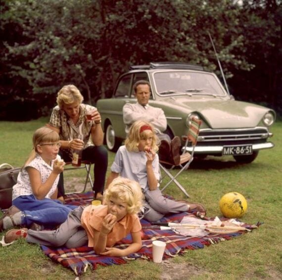 A family having a picnic on a blanket