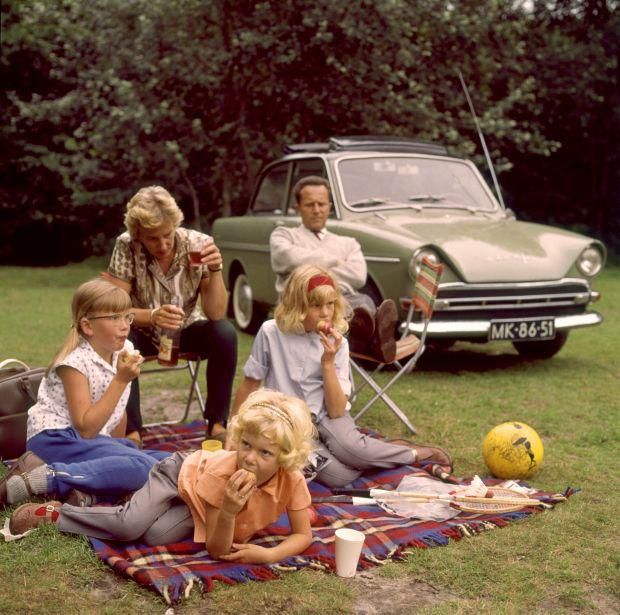 A family having a picnic on a blanket