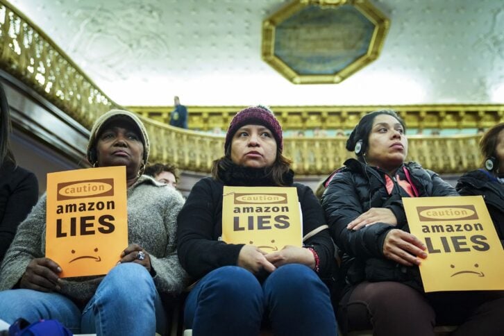 Protestors attend a New York City Council Finance Committee Hearing titled 'Amazon HQ2 Stage 2: Does the Amazon Deal Deliver for New York City Residents?' at New York City Hall, January 30, 2019 in New York City