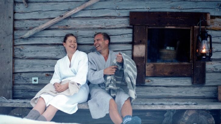Laughing couple at a sauna in Karelia, Finland