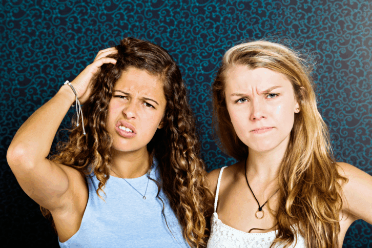 Confused looking teenage girls