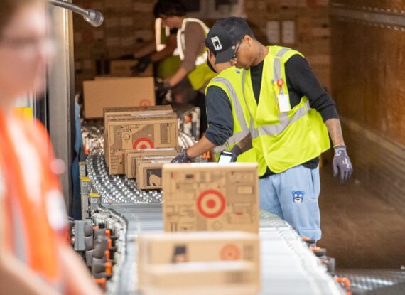 A photo of a group of Target workers at once of the retail chain's 'sortation' centers