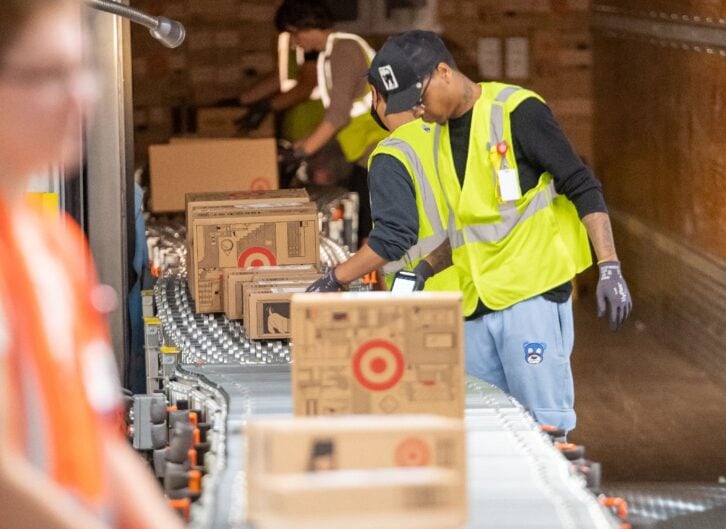 A photo of a group of Target workers at once of the retail chain's 'sortation' centers
