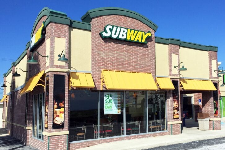 Exterior of Subway restaurant on a sunny day