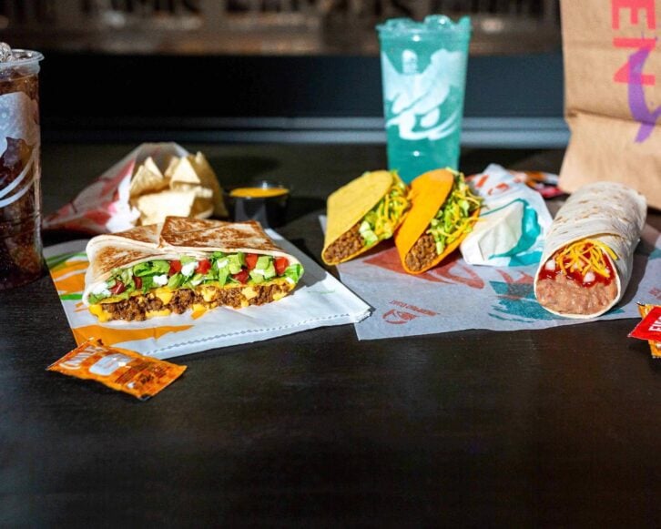 Taco Bell food arranged on a black table