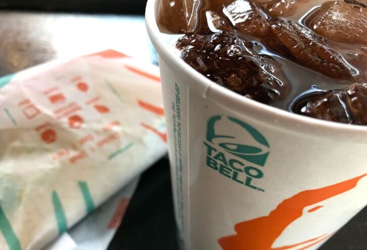In this photo illustration, a soda sits on a tray at a Taco Bell restaurant on February 22, 2018