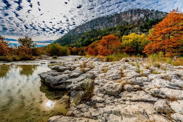 Texas Hill Country with sun beaming through stratus cloud cover