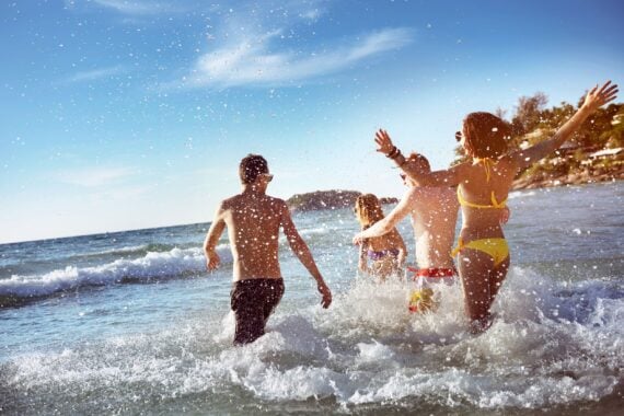 Friends splashing in the ocean