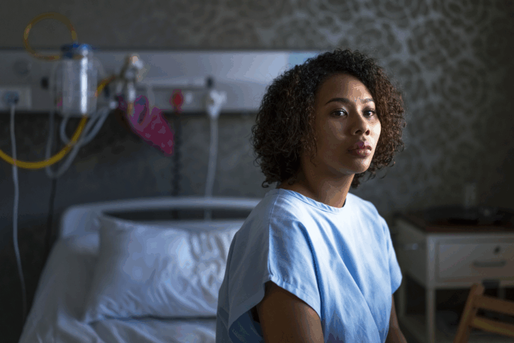 Young woman sitting in a hospital room