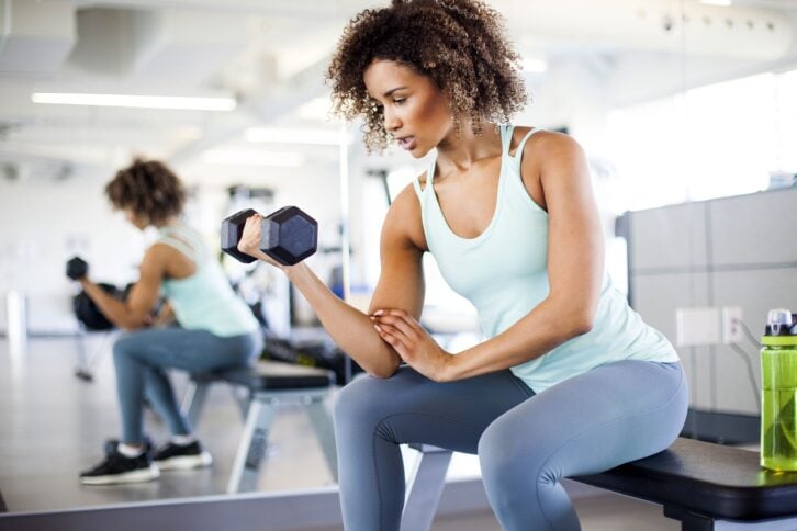 Woman lifting a dumbbell