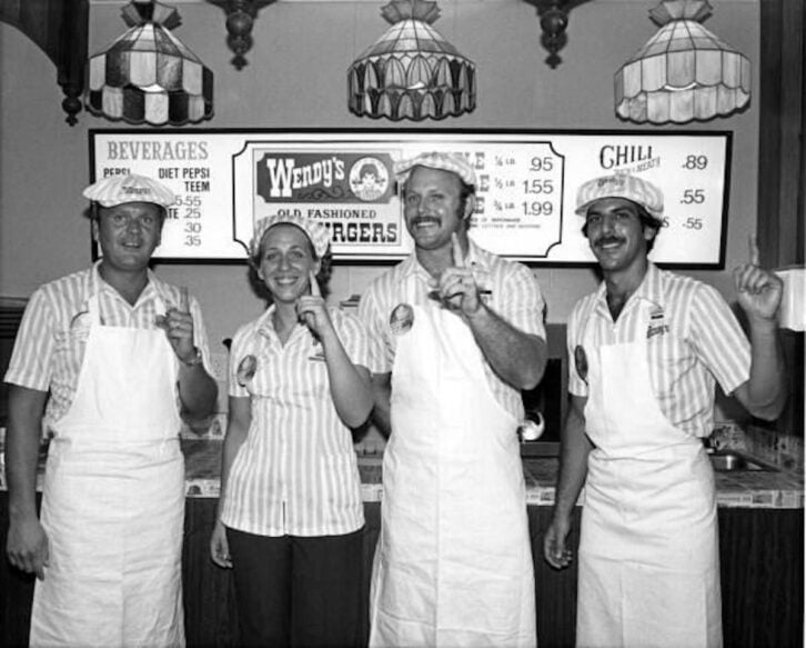 Wendy's employees assembled for a group portrait - Fort Lauderdale, FL (circa 1979/80). While it’s possible this may be 1980, it’s almost certain 70s design.
