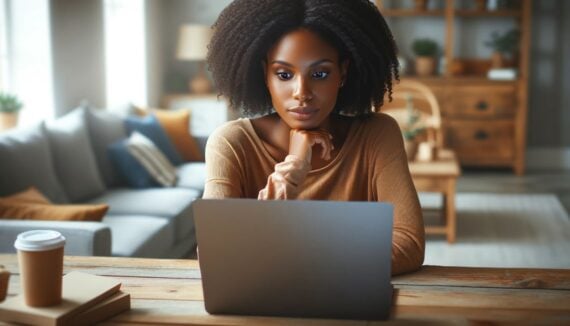 Woman looking at a computer while she online shops using Woot
