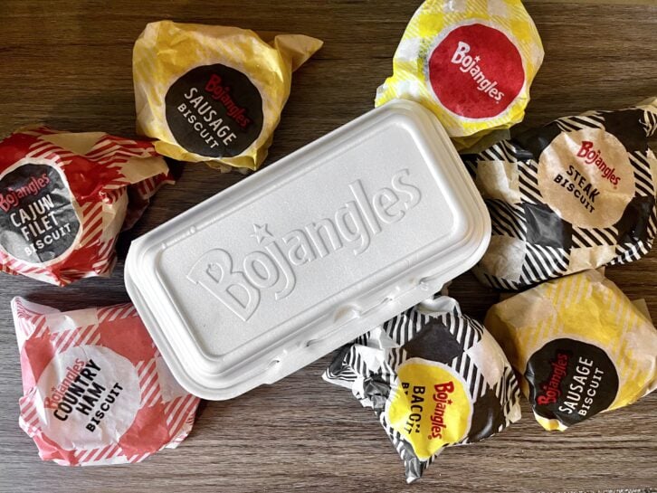 7 Bojangles biscuits spread out on a table