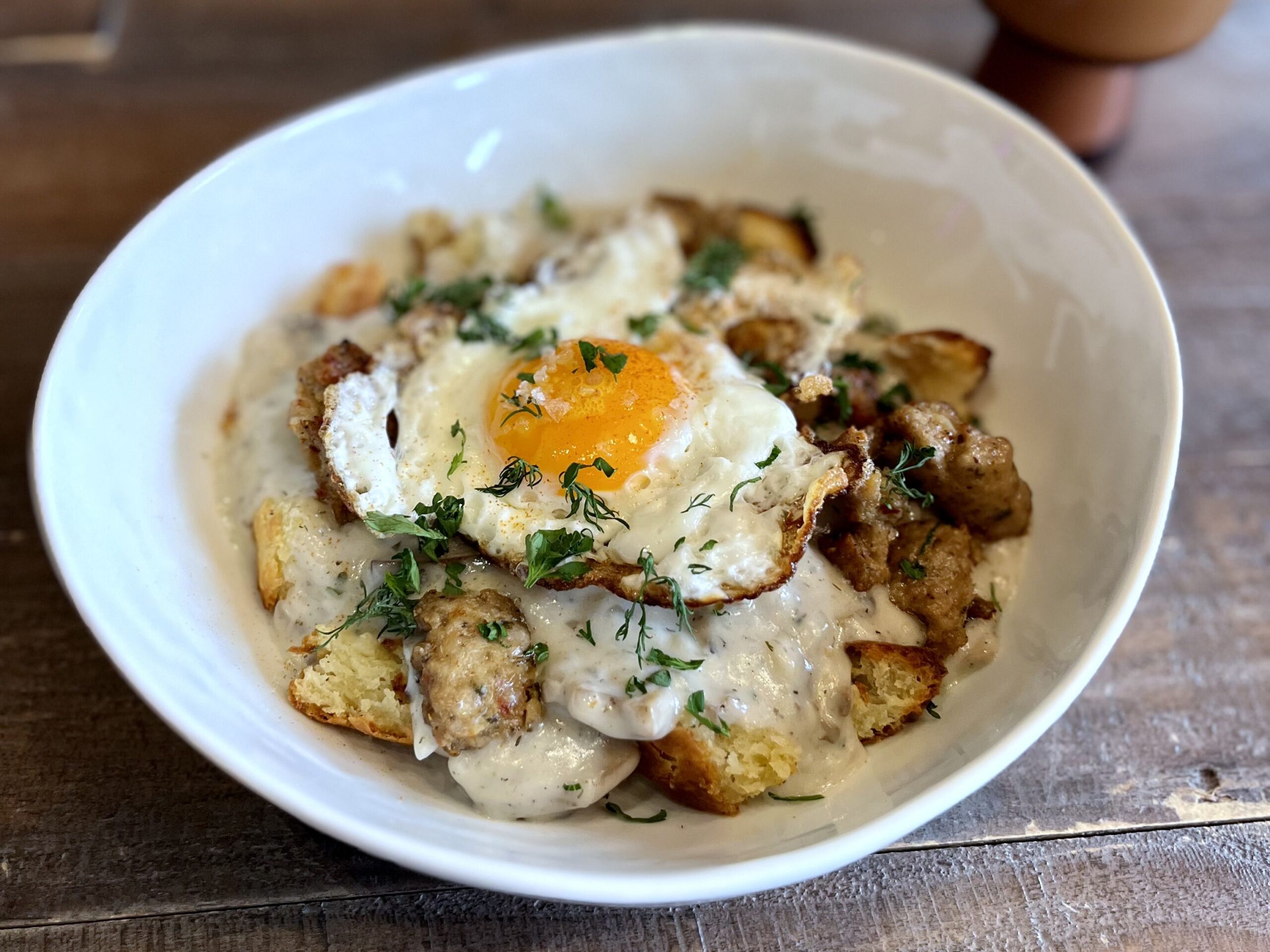 biscuits and gravy with eggs and sausage from butter punk restaurant in asheville north carolina