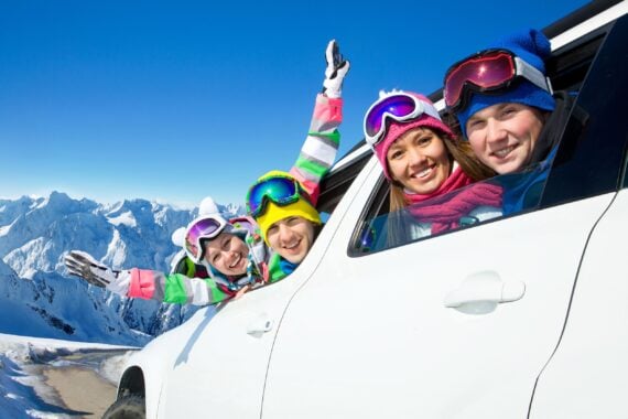 Family traveling by car on a vacation to the mountains