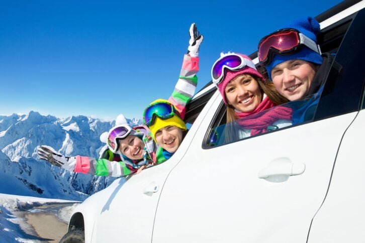 Family traveling by car on a vacation to the mountains