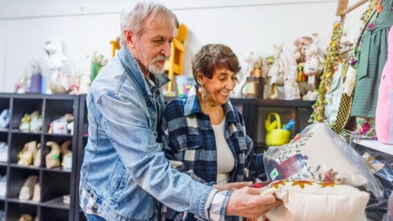 Elderly couple thrift store shopping