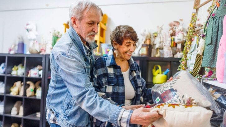Elderly couple thrift store shopping