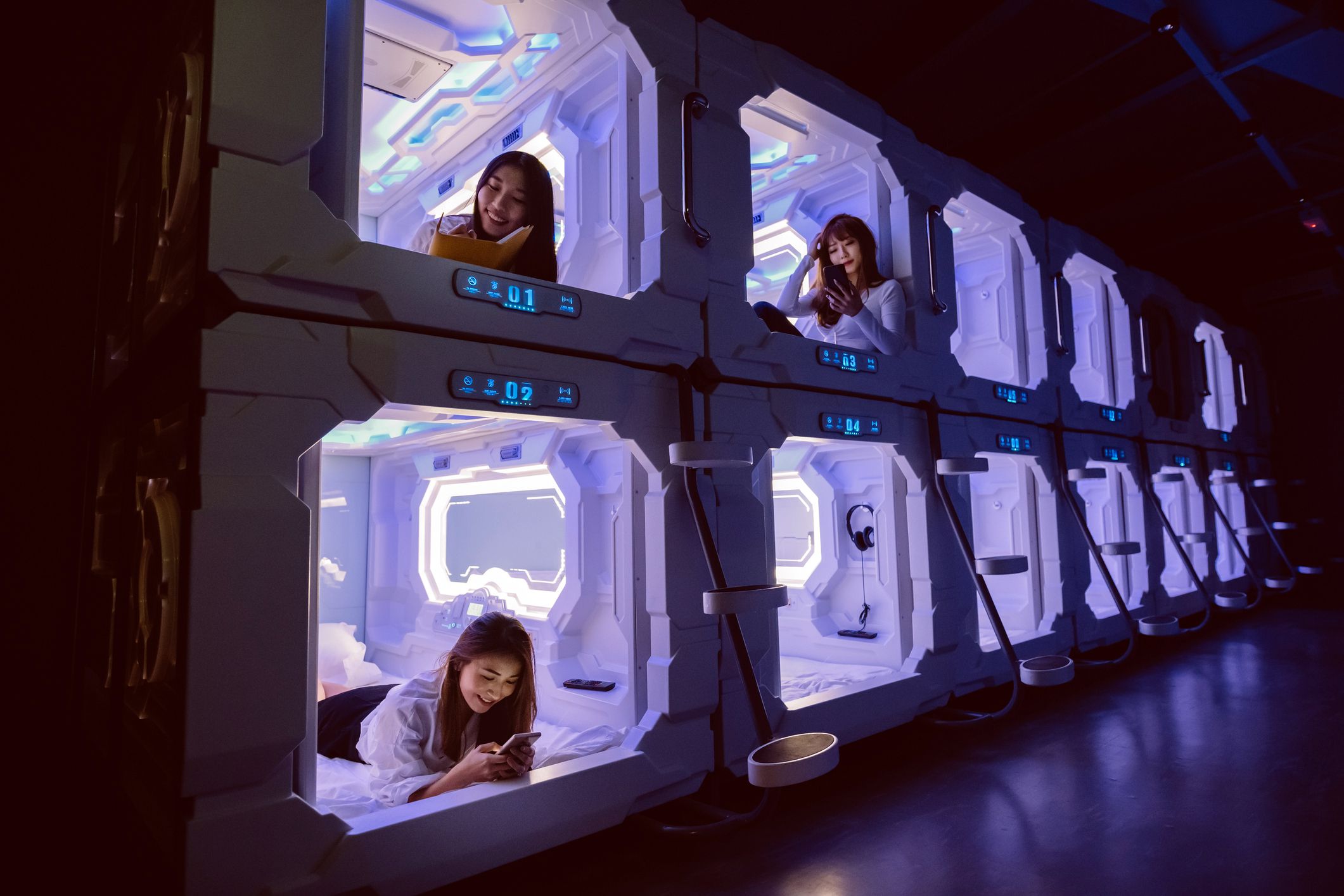 tourists in capsule hotel