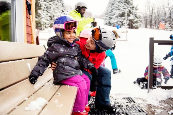 family getting ready to ski
